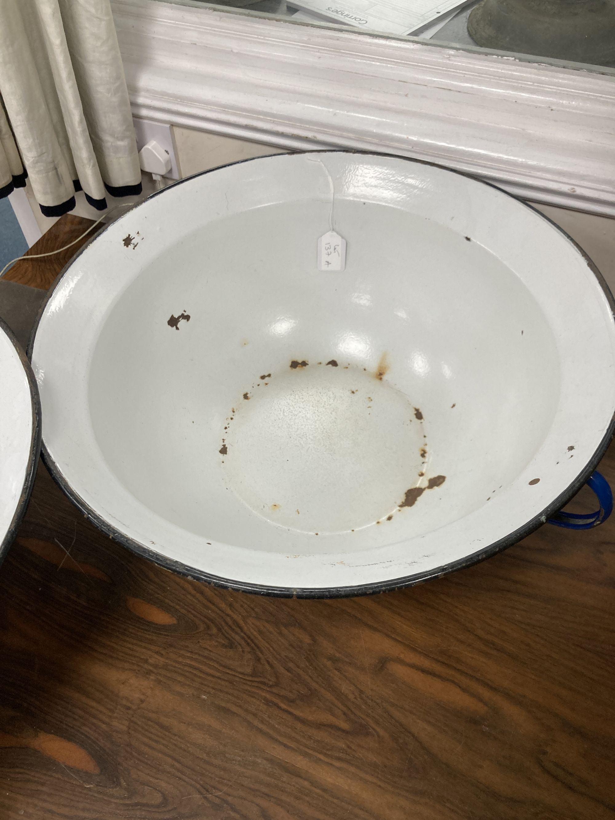 A pair of French enamel two-handled pans, 57cm diameter, 22cm high